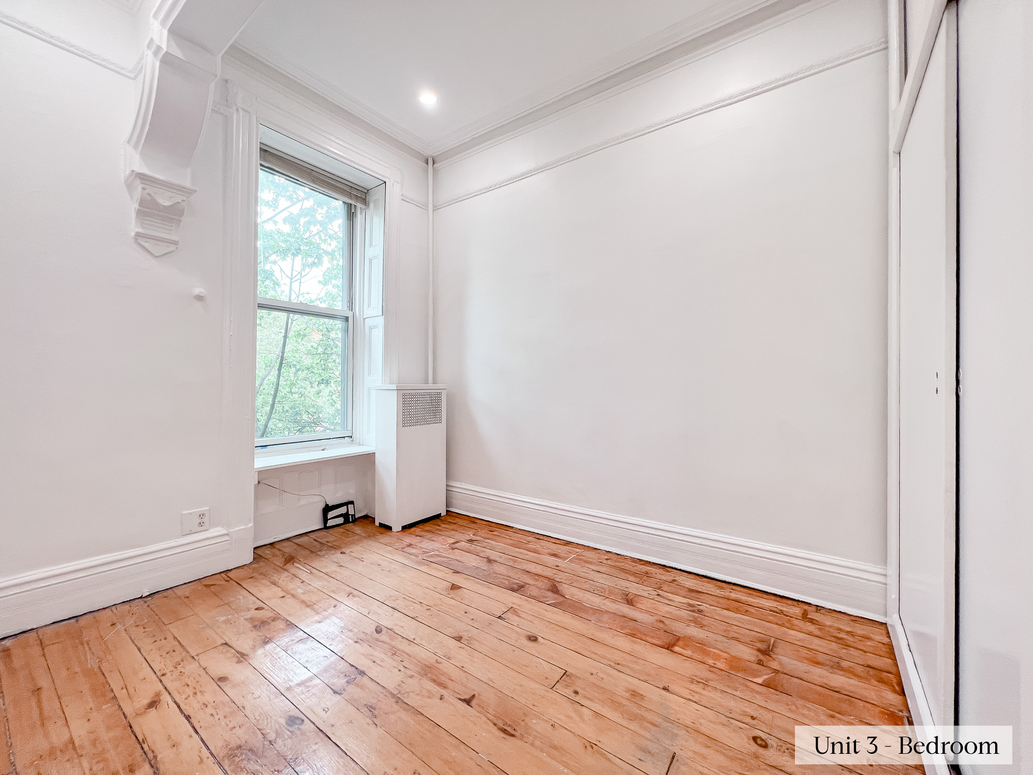 460 9th Street Brooklyn, NY 11215 - Photo 15 of 24 an empty room with wooden floor and windows