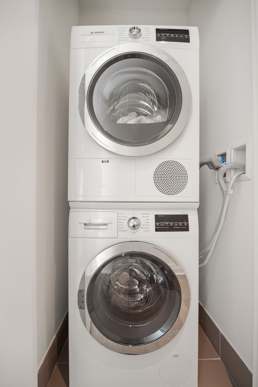 460 West 42nd Street, Unit 55F Manhattan, NY 10036 - Photo 8 of 9 a utility room with dryer and washer