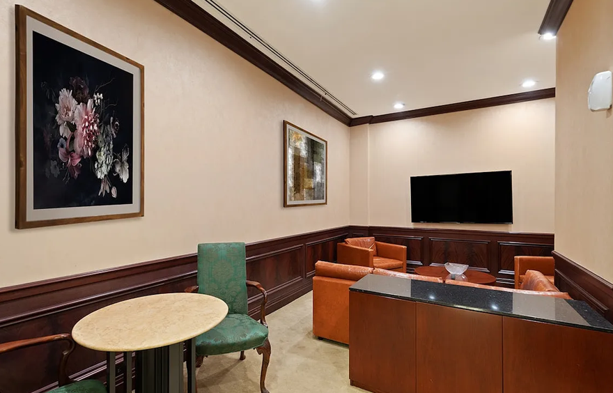 351 East 51st Street, Unit L5C Manhattan, NY 10022 - Photo 14 of 18 a living room with furniture and a flat screen tv