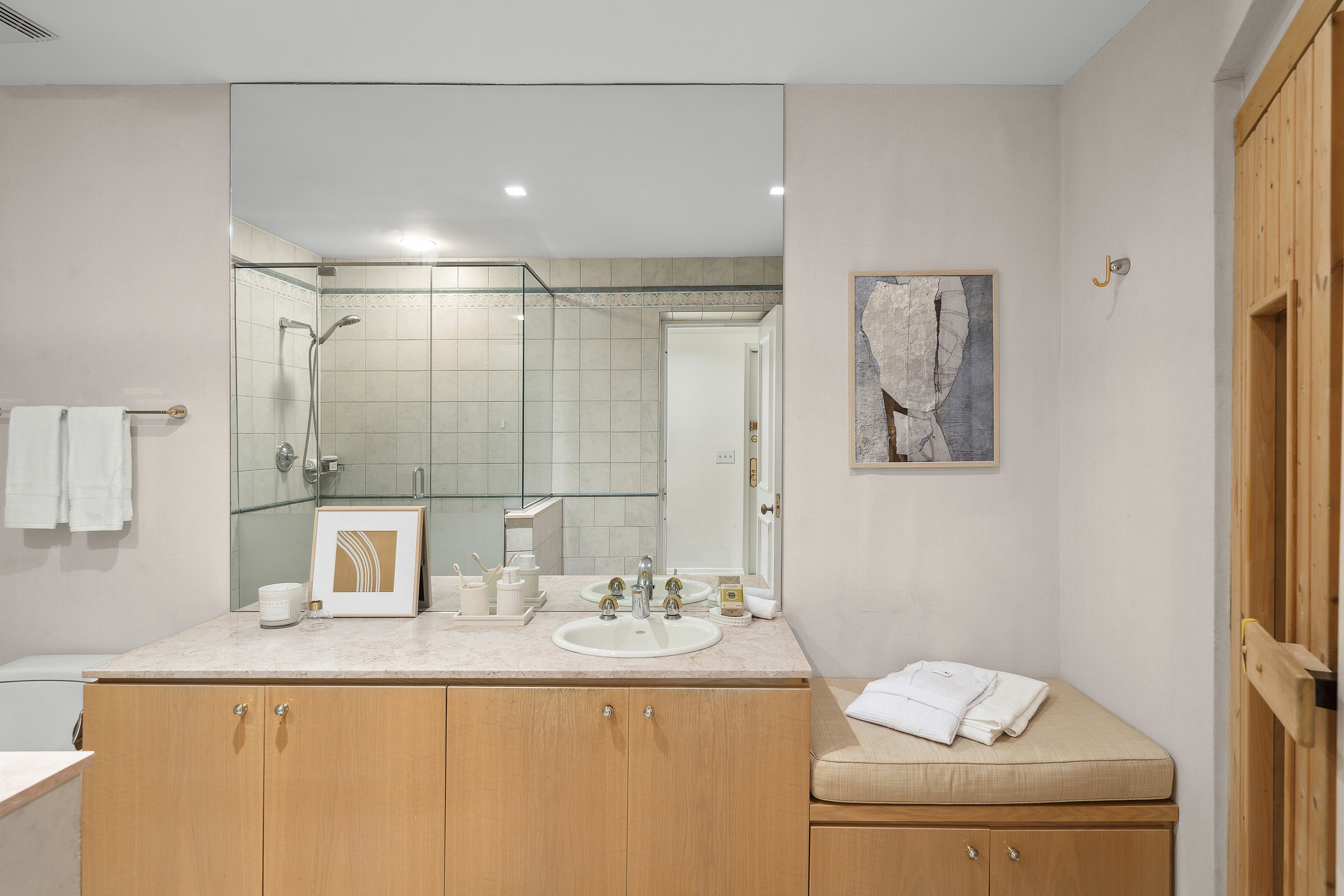 50 East 73rd Street Manhattan, NY 10021 - Photo 28 of 32 a bathroom with a granite countertop sink a toilet and shower