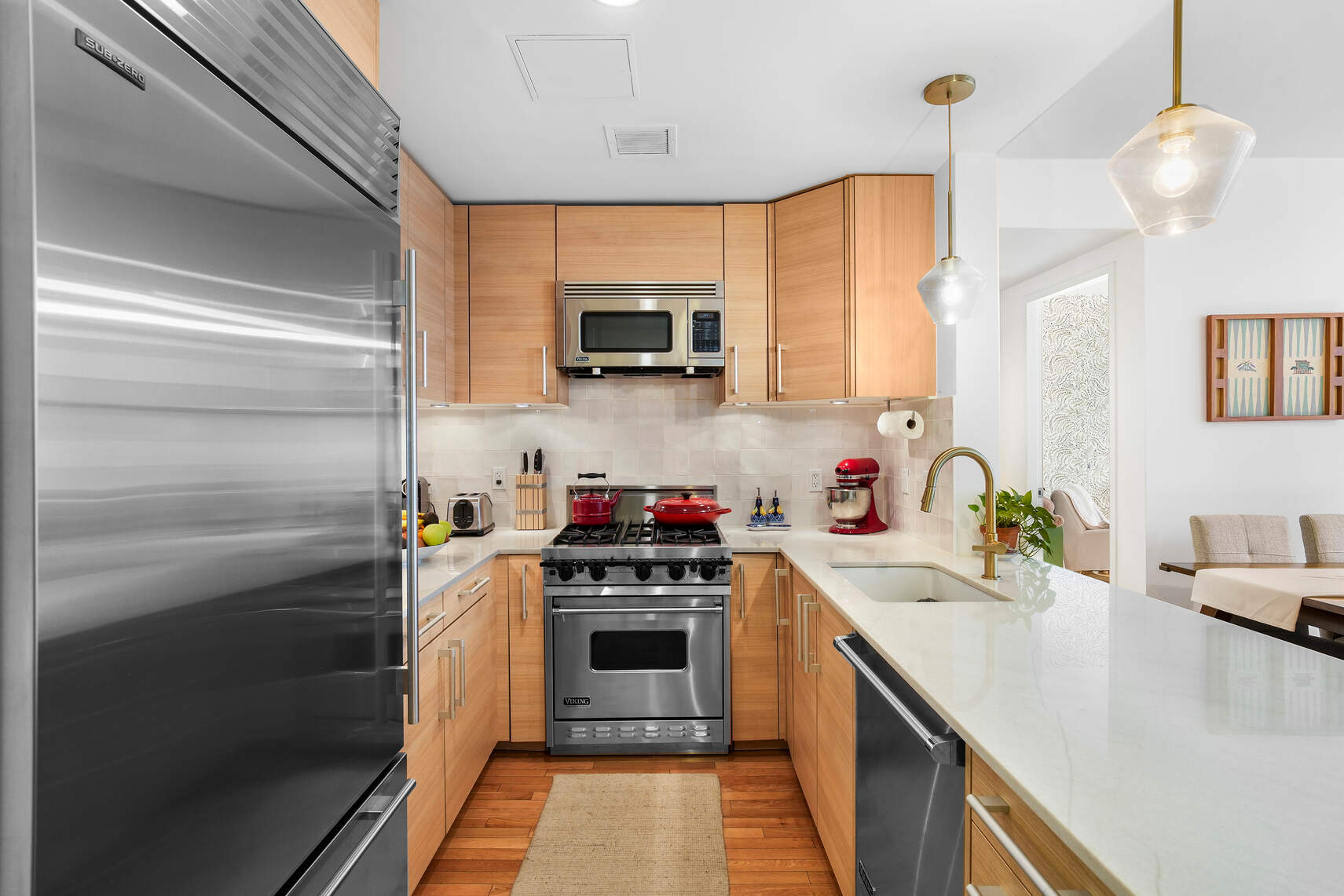 199 State Street, Unit 5C Brooklyn, NY 11201 - Photo 5 of 16 a kitchen with stainless steel appliances kitchen island granite countertop a sink and a stove