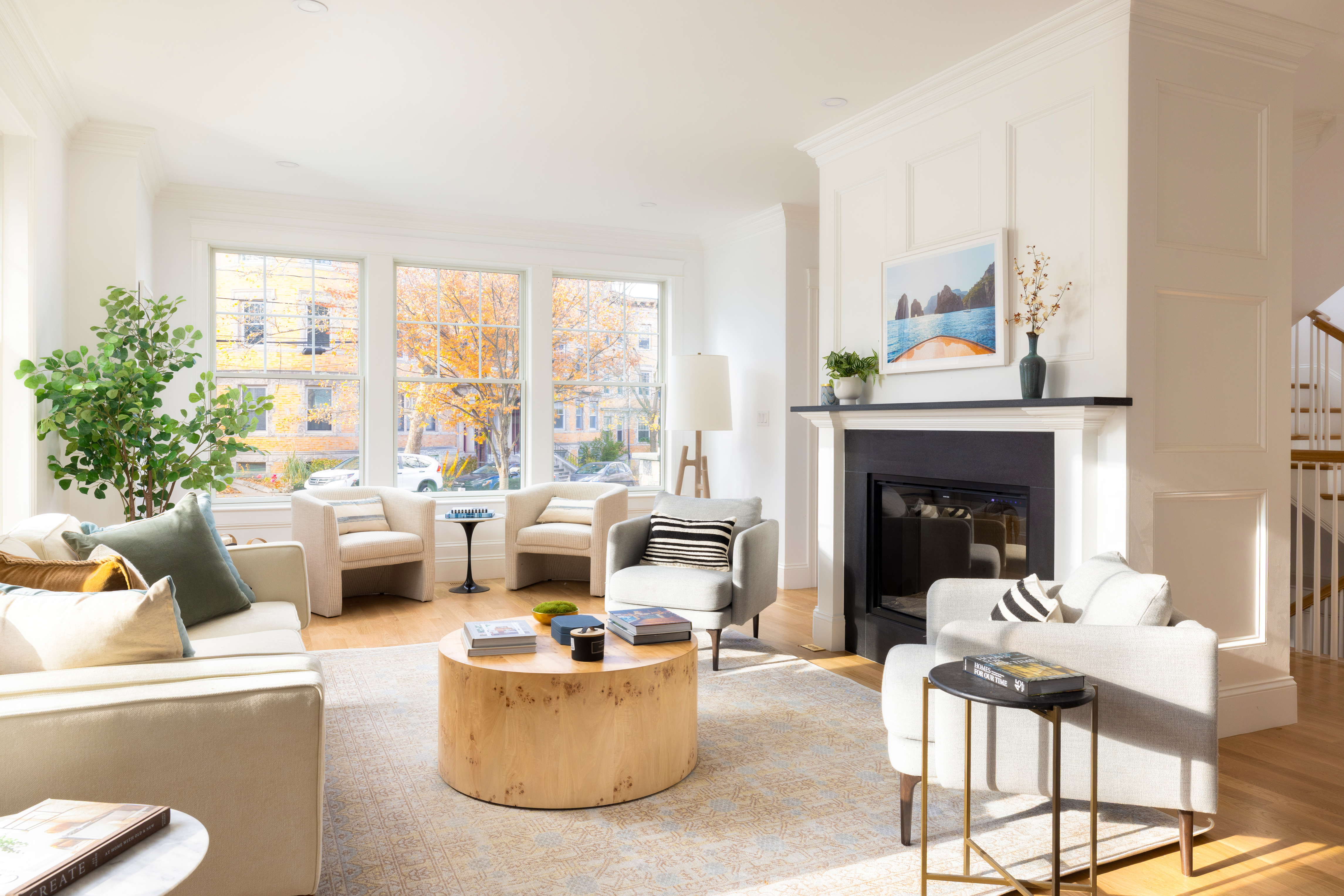 85 Naples Road Brookline, MA 02446 - Photo 2 of 36 a living room with furniture and a fireplace