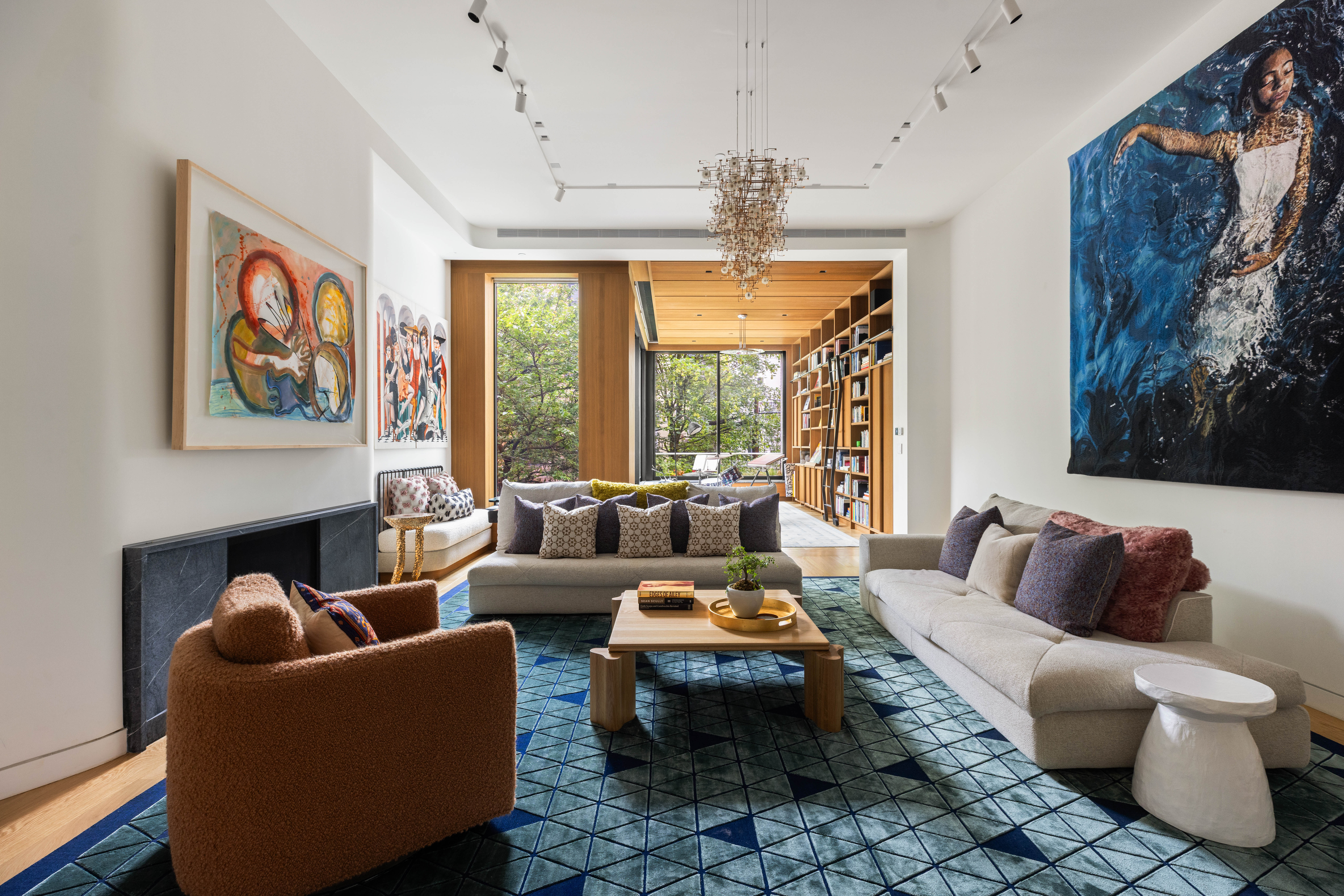 535 1st Street Brooklyn, NY 11215 - Photo 10 of 36 a living room with furniture and a chandelier