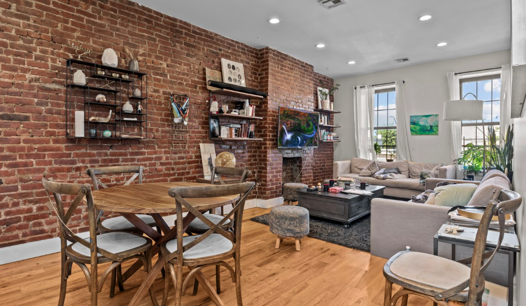 251 Troy Avenue Brooklyn, NY 11213 - Photo 6 of 9 a living room with furniture and a fireplace