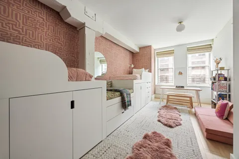 a bedroom with furniture and a fireplace