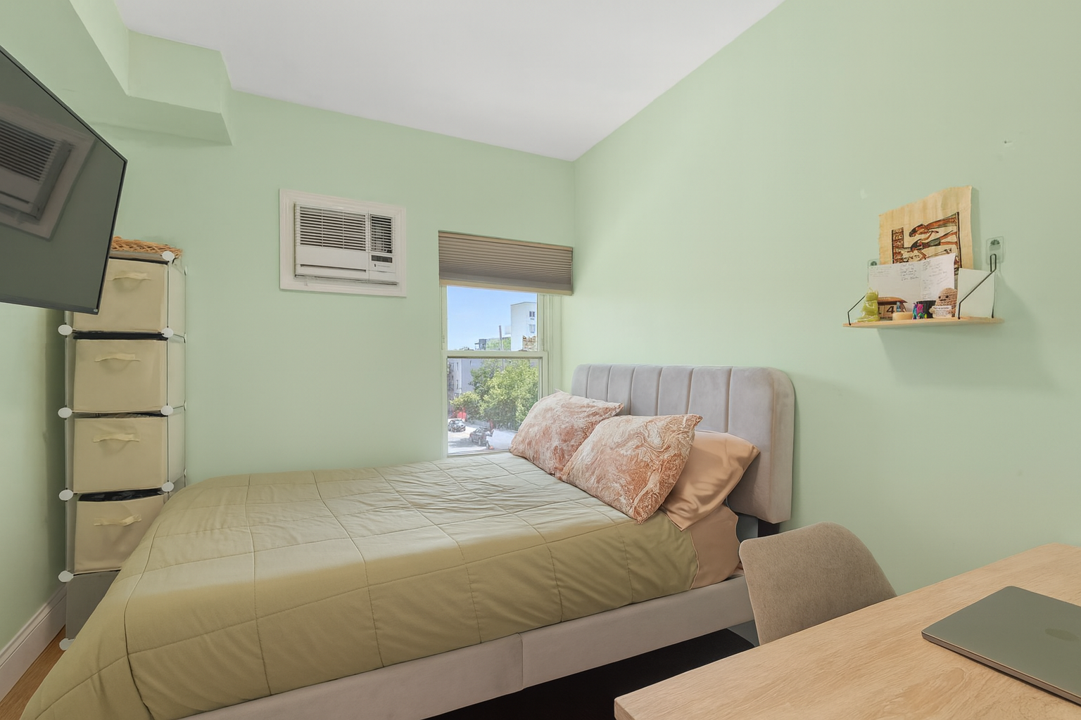 189 Woodpoint Road Brooklyn, NY 11211 - Photo 17 of 21 a bedroom with a bed and wooden floor