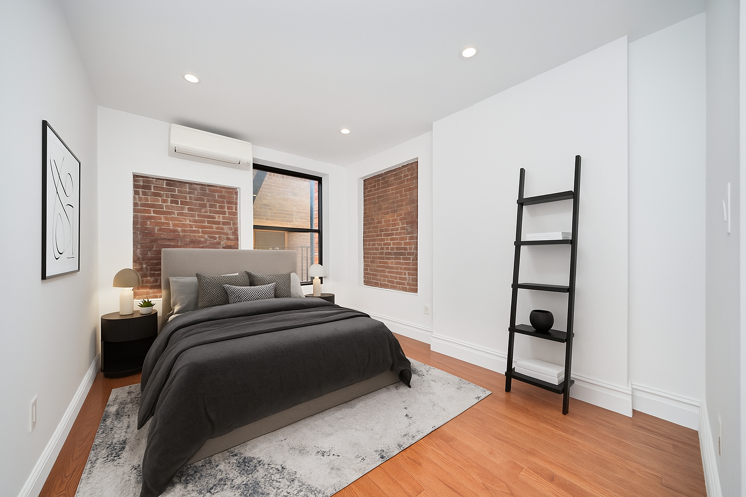 941 Columbus Avenue, Unit 1A Manhattan, NY 10025 - Photo 5 of 14 a bedroom with a bed and a window