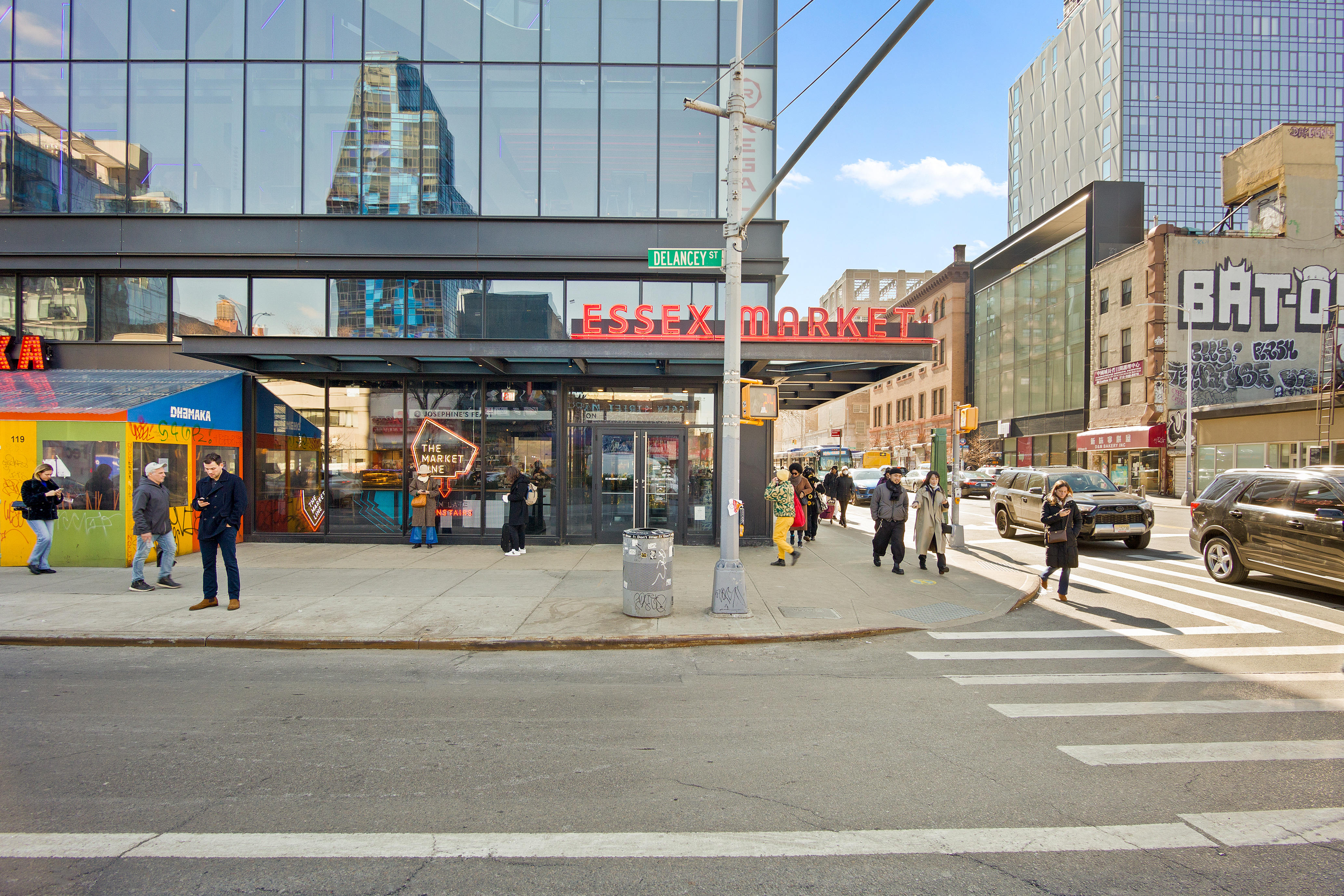 417 Grand Street, Unit D1801 Manhattan, NY 10002 - Photo 17 of 23 a view of street with shops on a street