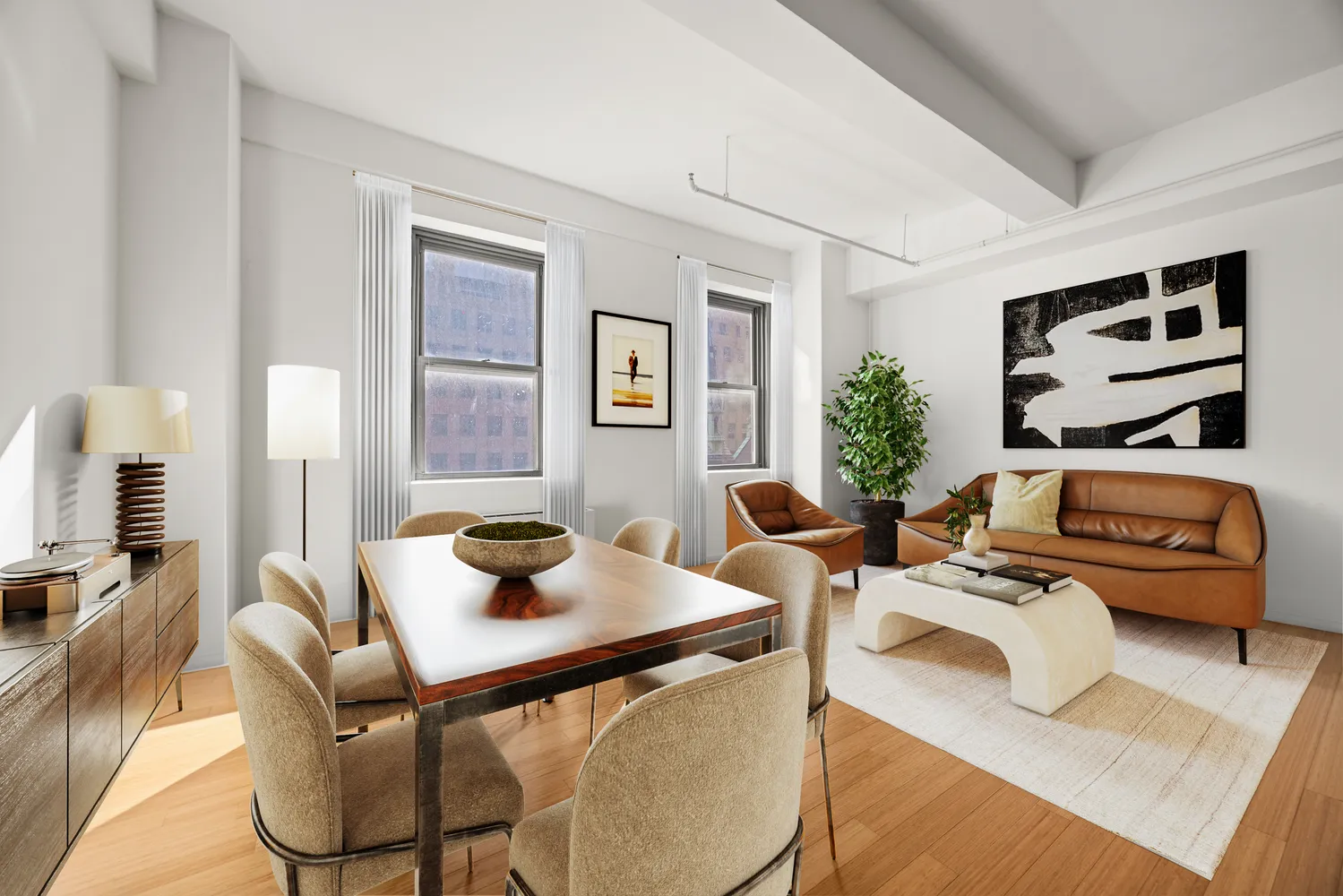 a living room with furniture and wooden floor