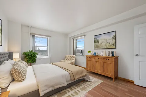 a bedroom with a large bed and a couch