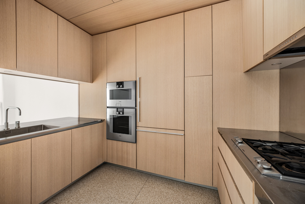 a kitchen with stainless steel appliances a refrigerator and a sink