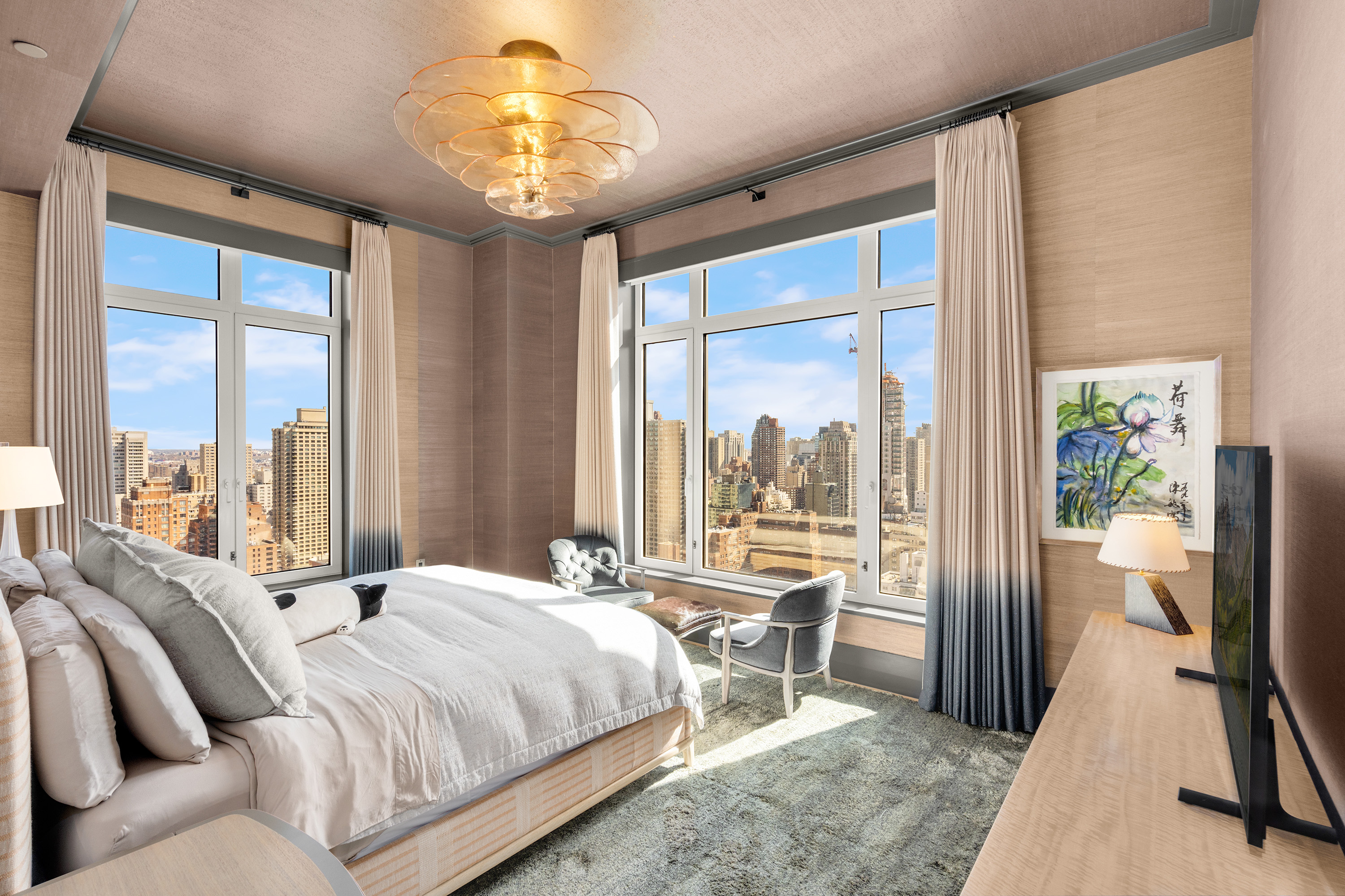 200 East 83rd Street, Unit 24C Manhattan, NY 10028 - Photo 11 of 35 a bedroom with a bed and a large window with the outer view