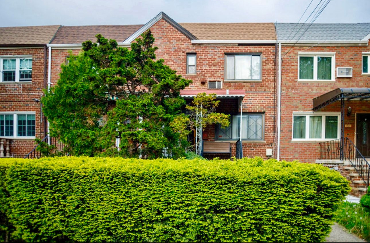 1729 East 54th Street, Unit 1 Brooklyn, NY 11234 - Photo 2 of 6 front view of a brick house with a yard