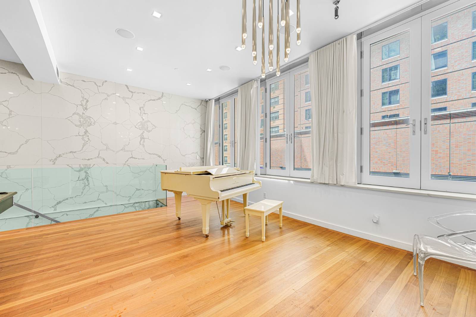 124 East 13th Street, Unit 3 Manhattan, NY 10003 - Photo 3 of 26 a view of a dining room with furniture and wooden floor