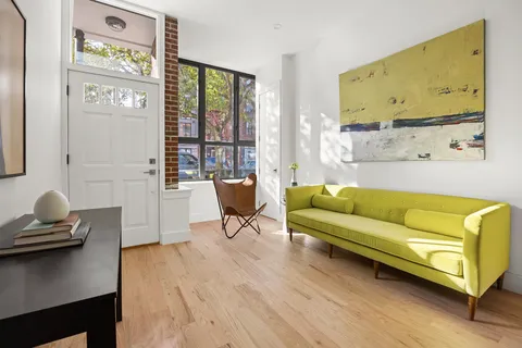 a living room with furniture and window