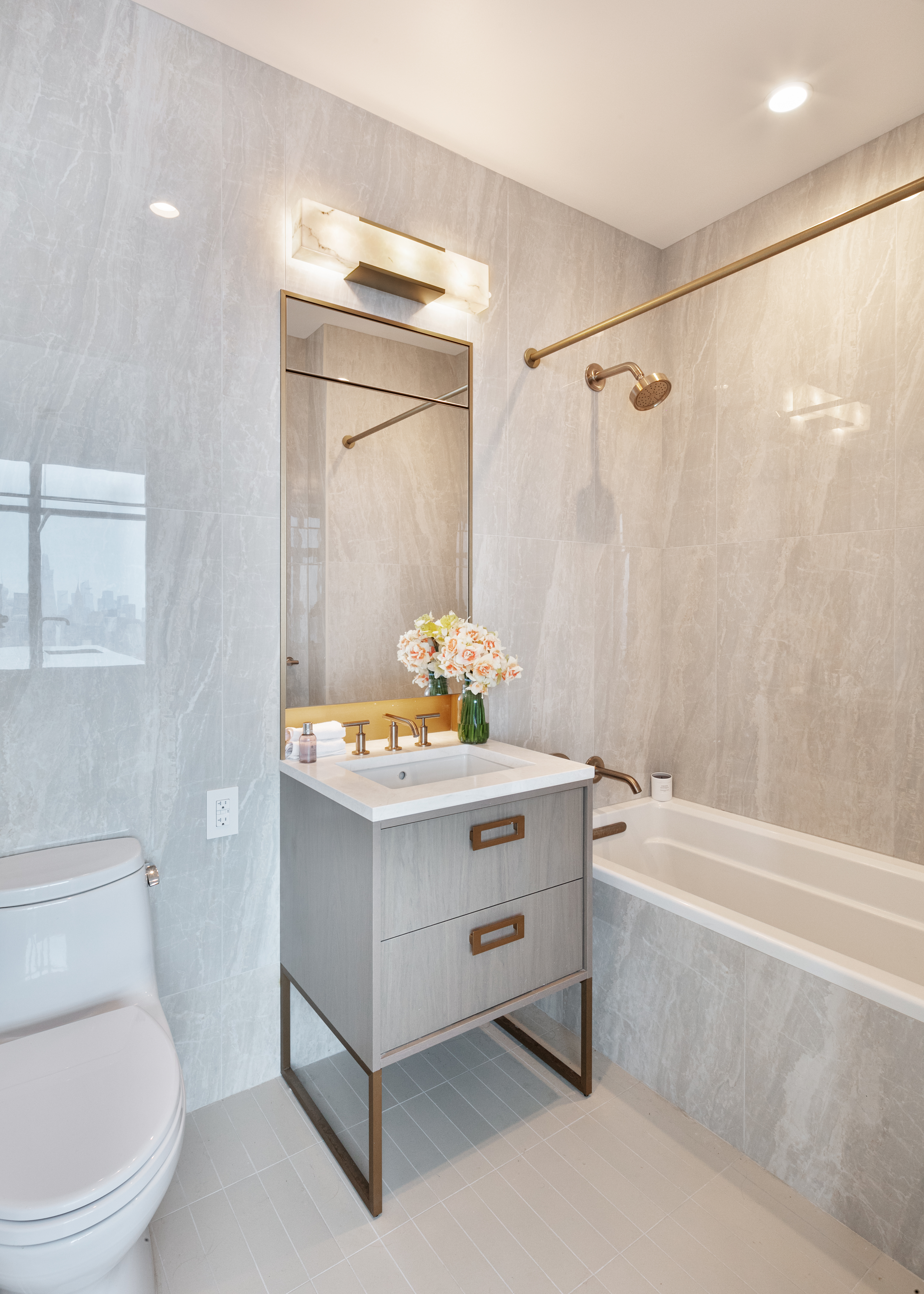 45-3 Ct Square West, Unit PH202 Queens, NY 11101 - Photo 7 of 12 a bathroom with a sink a toilet and shower