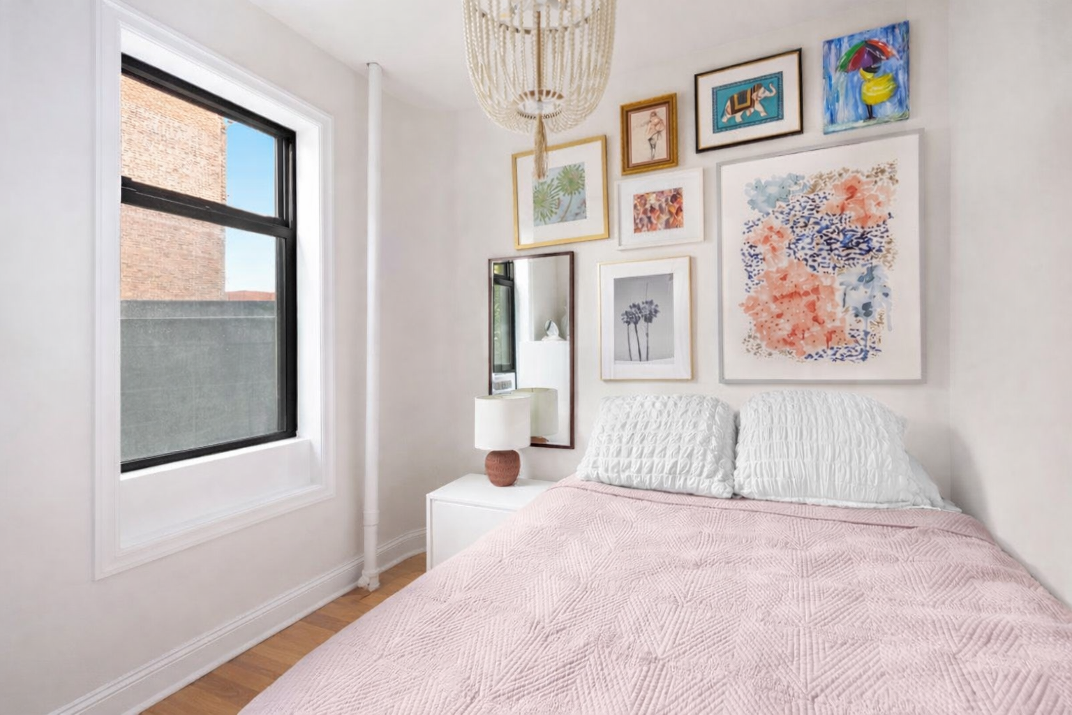 227 West 11th Street, Unit 43 Manhattan, NY 10014 - Photo 4 of 6 a bedroom with bed and wall painting with wooden floor