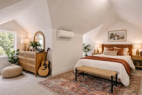 a bedroom with a bed and a window