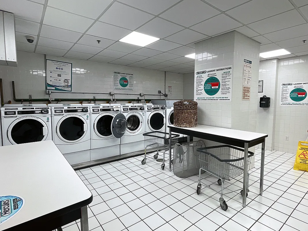 400 East 90th Street, Unit 15B Manhattan, NY 10128 - Photo 11 of 15 a utility room with dryer and washer