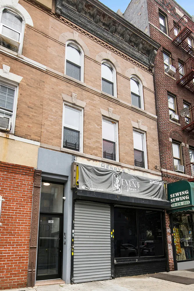 a view of a building with retail shop and windows