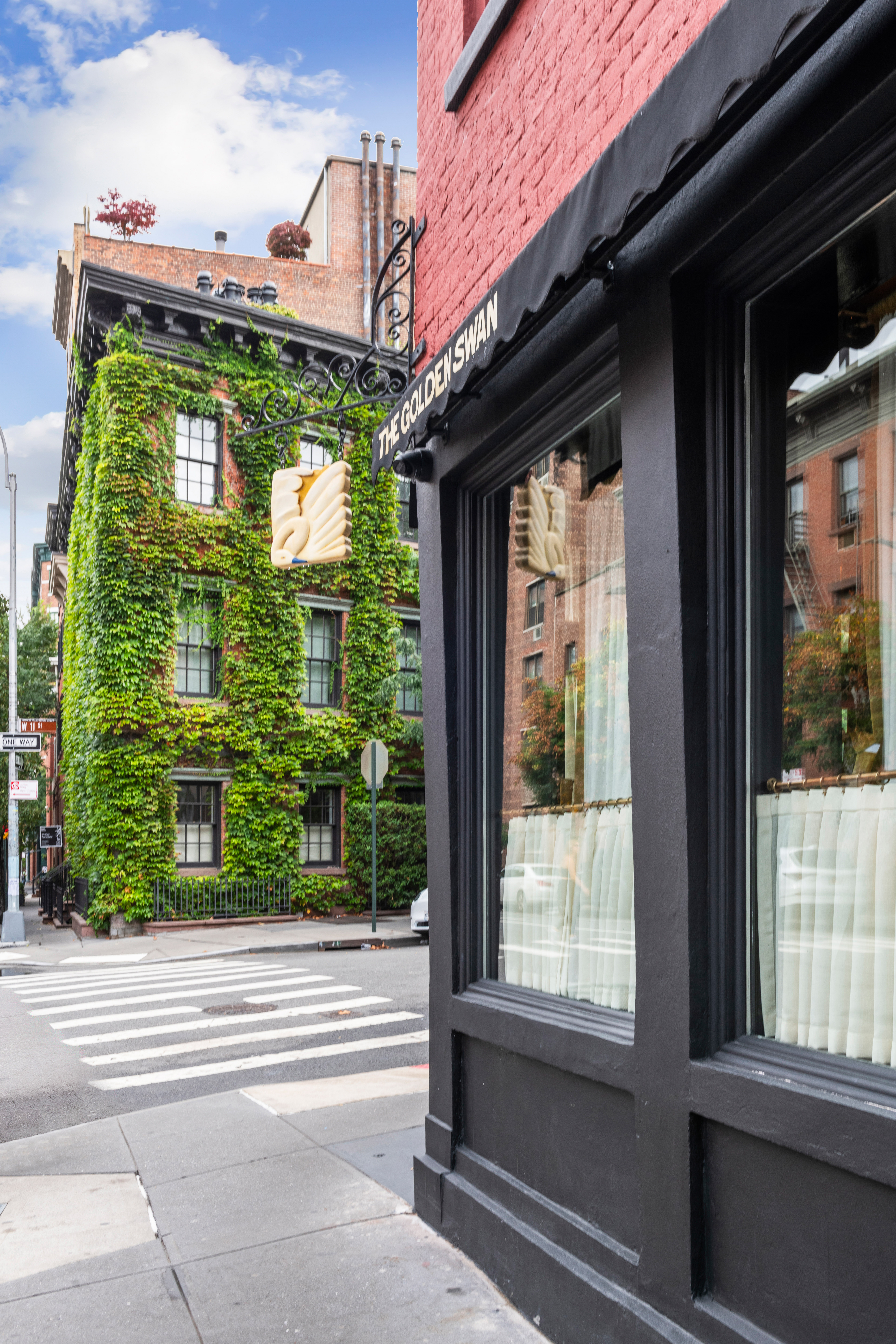 765 Greenwich Street, Unit 1 Manhattan, NY 10014 - Photo 13 of 14 a front view of a house with a porch