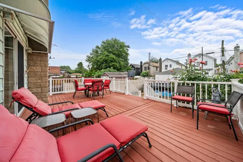 a sitting area with furniture on wooden floor