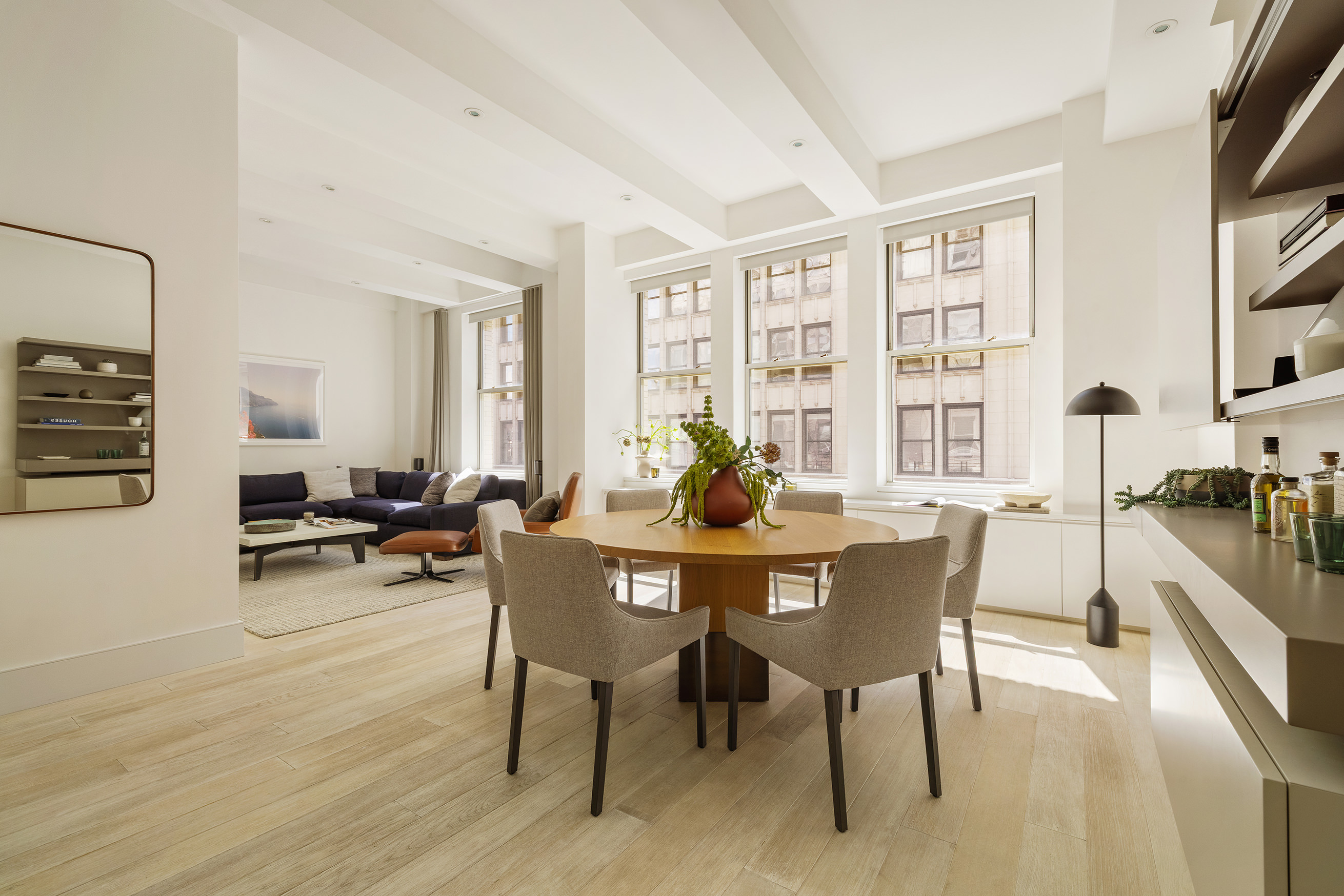 49 East 21st Street, Unit 9A Manhattan, NY 10010 - Photo 5 of 18 a view of a dining room with furniture window and wooden floor