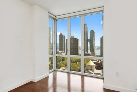 a view of a room with a large window