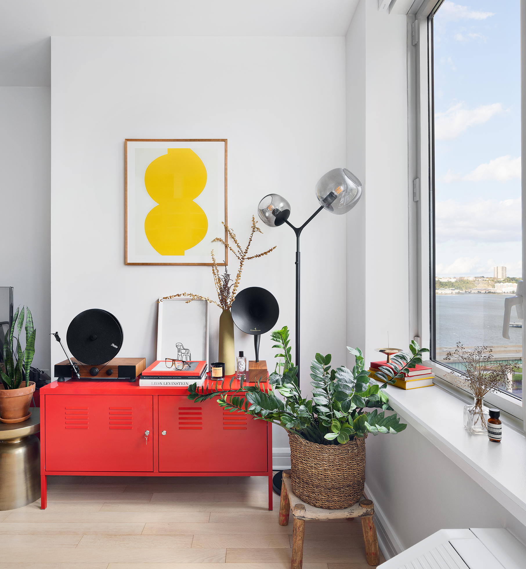 80 Riverside Boulevard, Unit 12D Manhattan, NY 10069 - Photo 5 of 16 a living room with furniture and a mirror