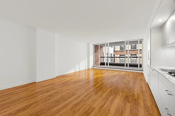 84 White Street, Unit 5A Manhattan, NY 10013 - Photo 5 of 7 a view of a livingroom with furniture and wooden floor
