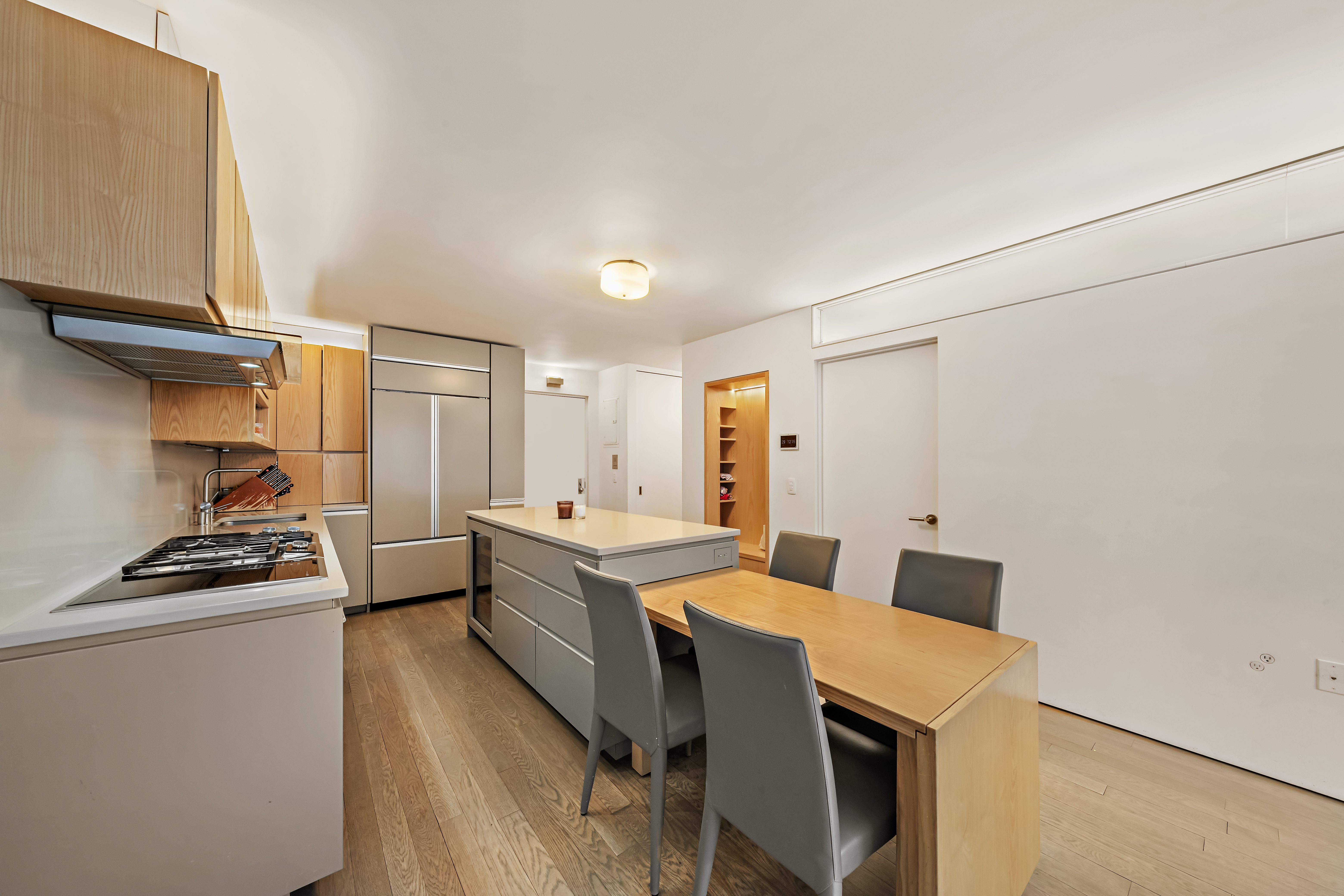 280 Rector Place, Unit 5IJ Manhattan, NY 10280 - Photo 3 of 10 a kitchen with a stove a sink and a refrigerator