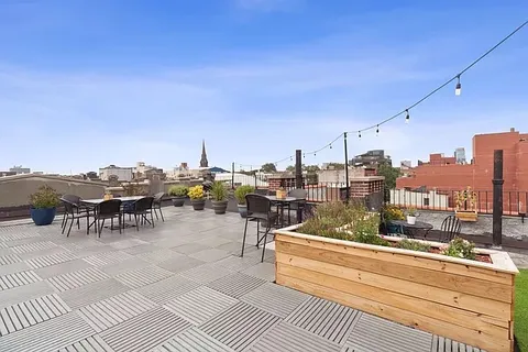 a view of a terrace with seating area