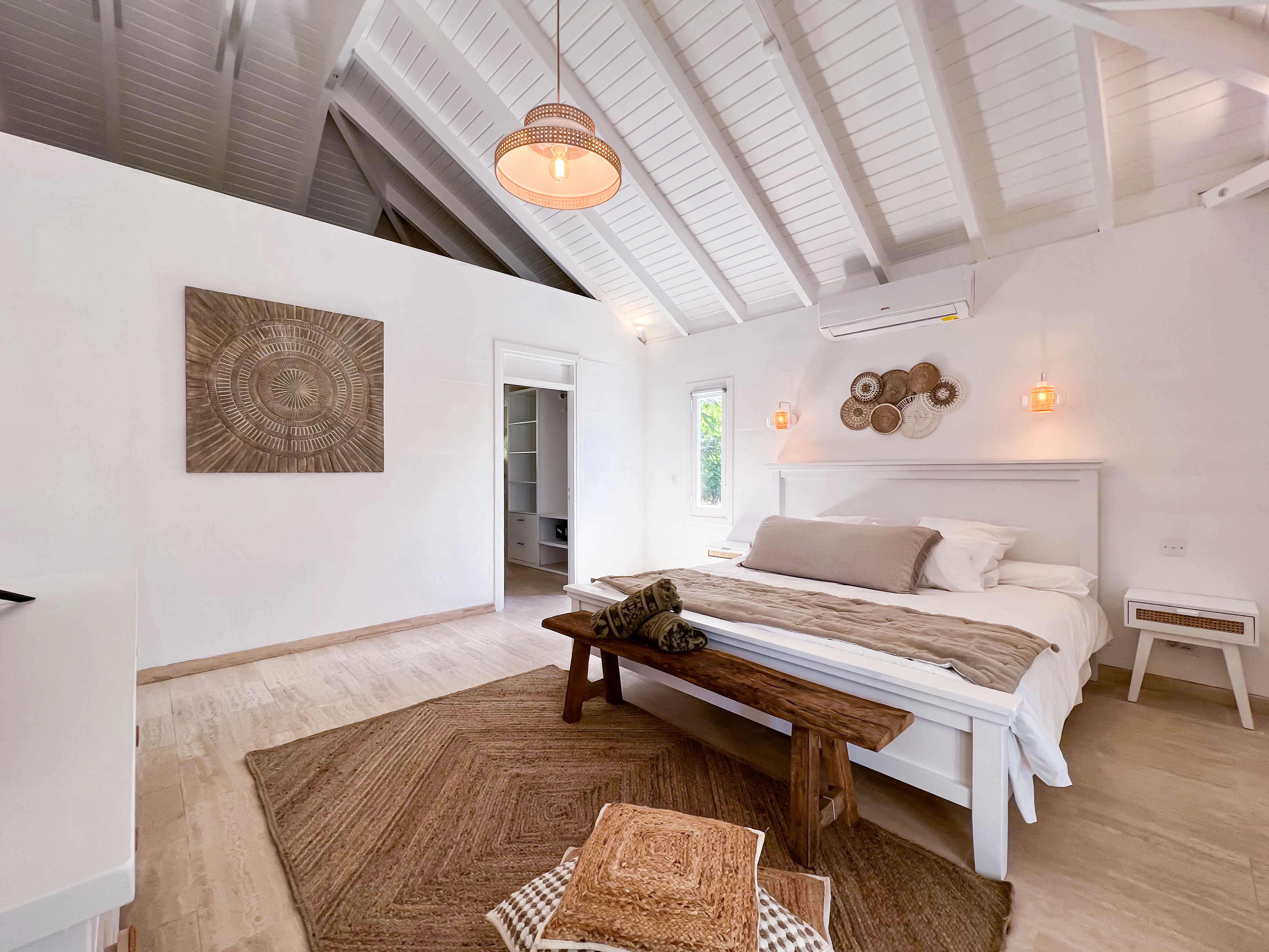 Terres Basses St. Martin, undefined 97150 - Photo 17 of 32 a bedroom with a bed and a chandelier