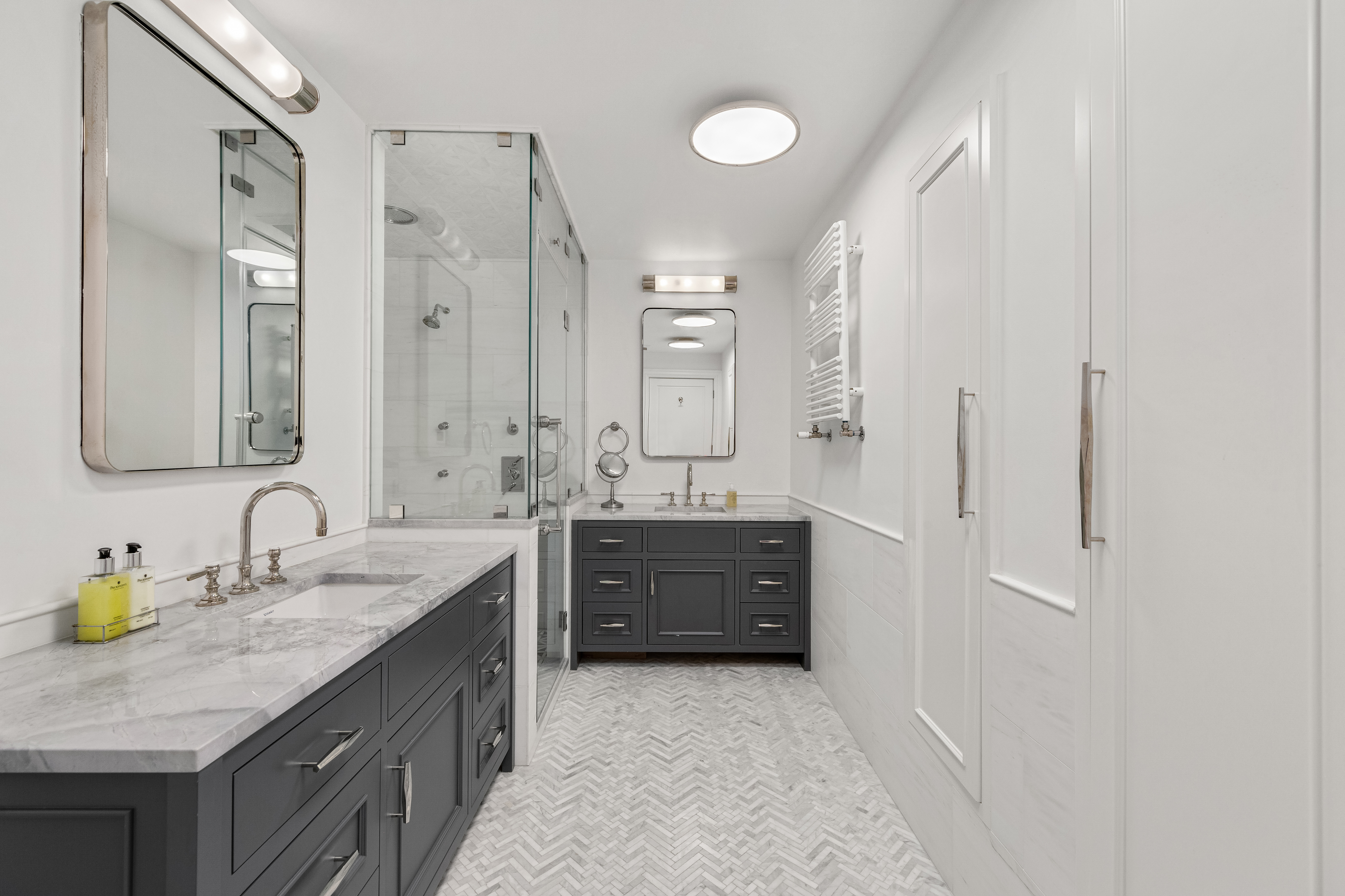 110 West 81st Street Manhattan, NY 10024 - Photo 12 of 30 a spacious bathroom with a granite countertop sink mirror and a
