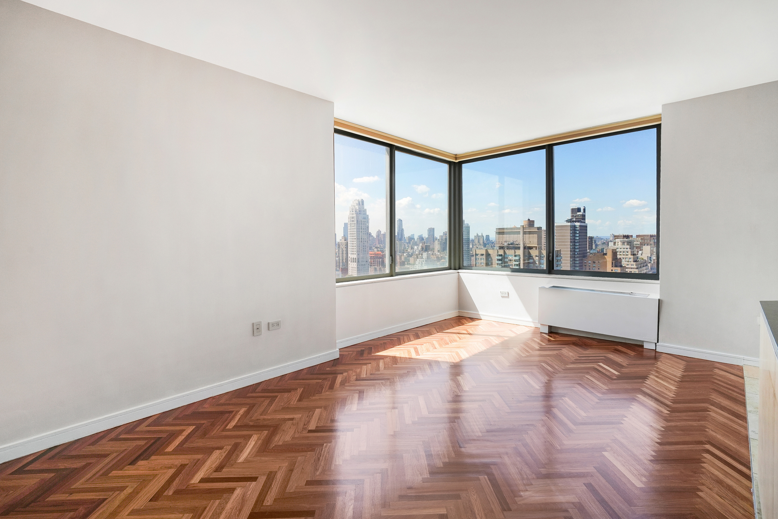 360 East 88th Street, Unit 34A Manhattan, NY 10128 - Photo 10 of 35 a view of an empty room with a window