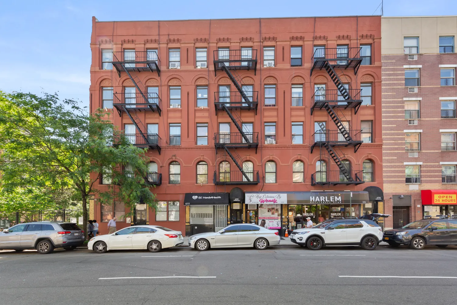 a backyard of a building with large trees