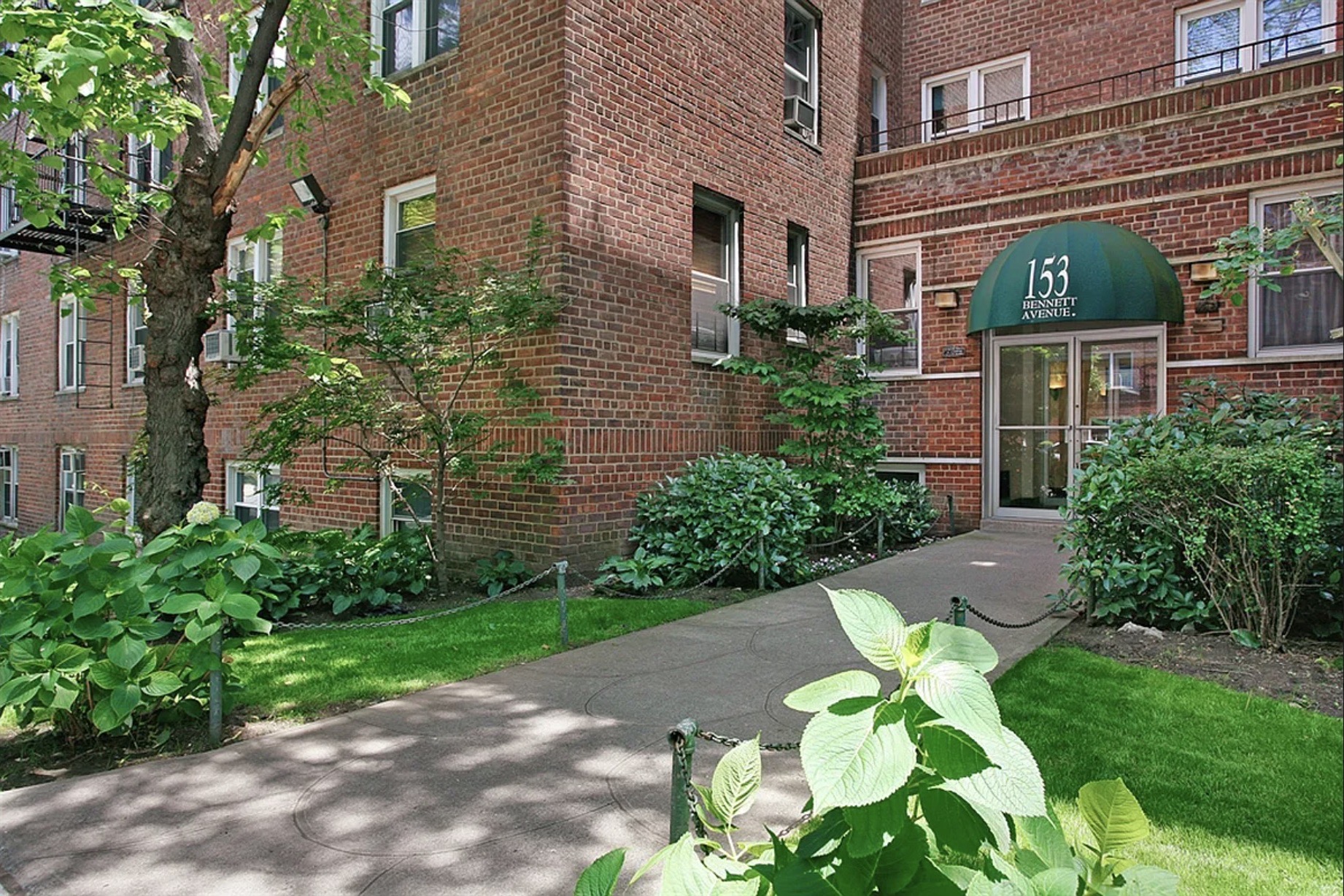 143 Bennett Avenue, Unit 6R Manhattan, NY 10040 - Photo 19 of 22 a front view of a house with garden