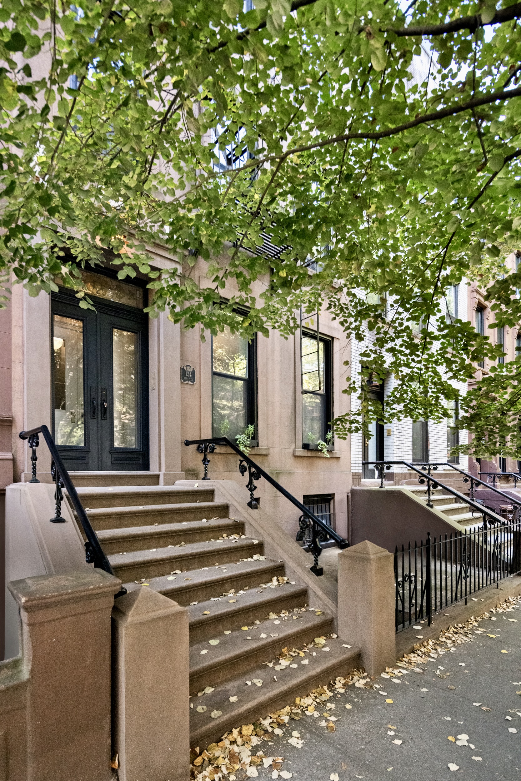 134 Berkeley Place, Unit 3 Brooklyn, NY 11217 - Photo 29 of 30 a front view of a house with a tree
