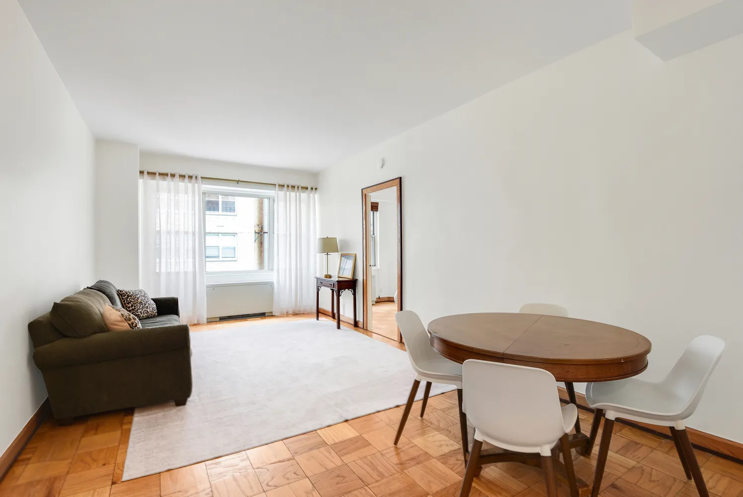 a bedroom with a bed and a chair