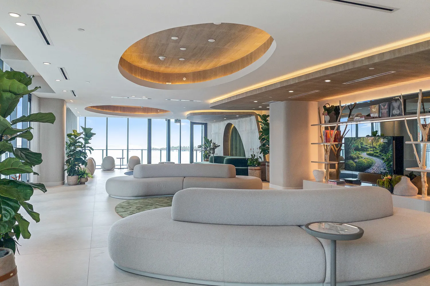 a view of a dining room with furniture and a floor to ceiling window
