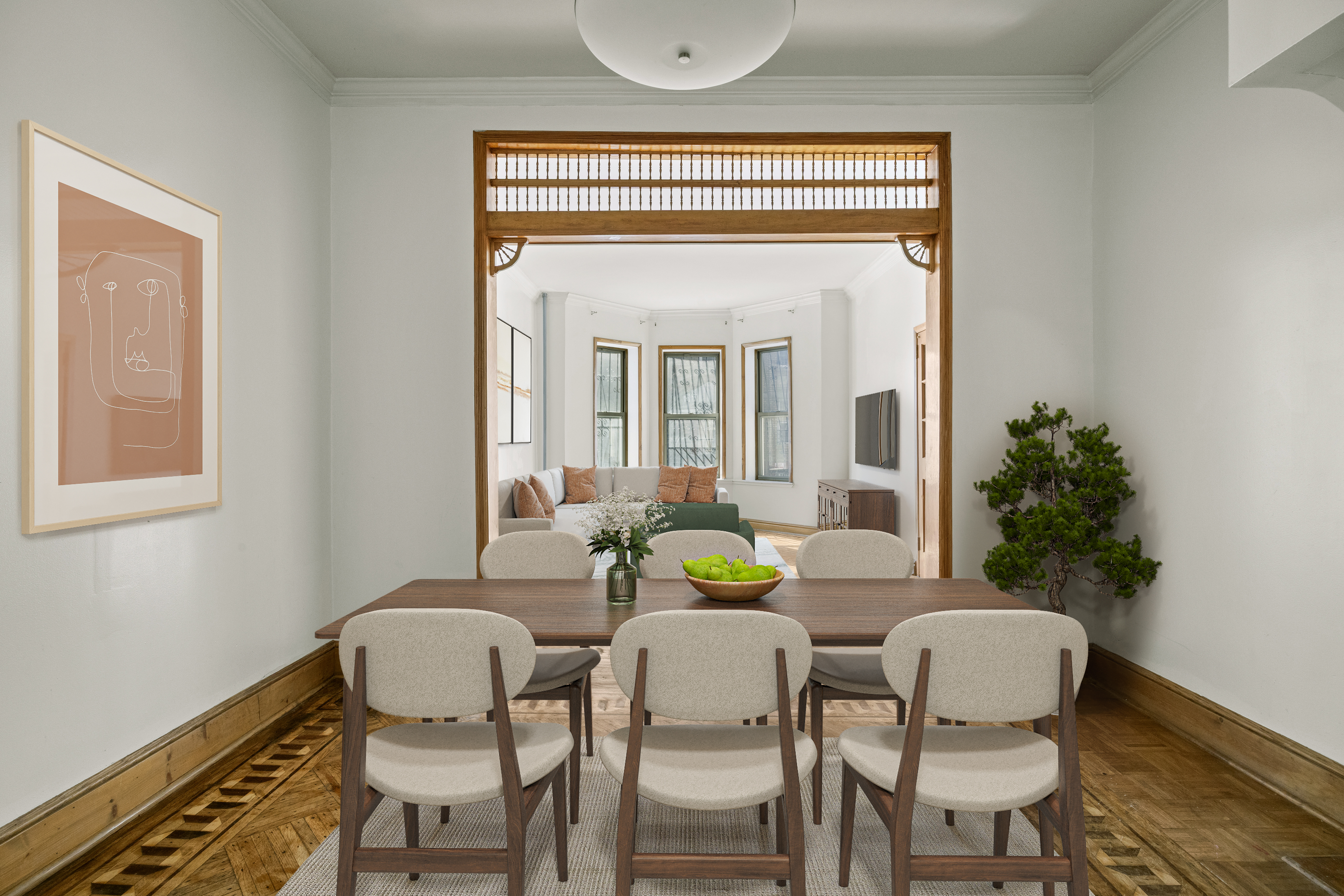 a view of a dining room with furniture and wooden floor