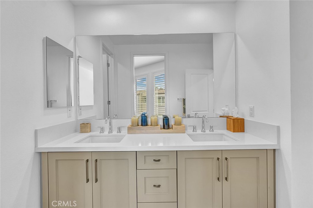 1632 Doheny Way Dana Point, CA 92629 - Photo 14 of 33 a bathroom with double sink and a mirror
