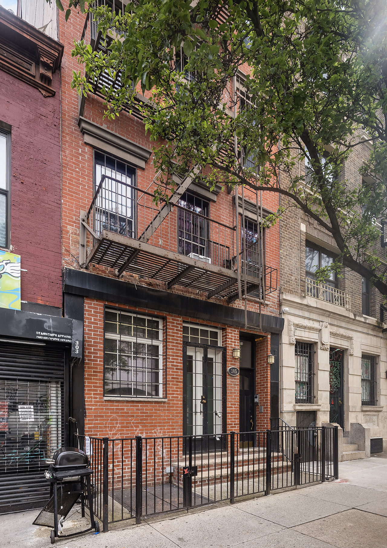 305 East 4th Street, Unit 2 Manhattan, NY 10009 - Photo 10 of 11 a front view of a house with a garden