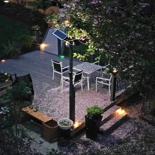 an aerial view of a house with yard swimming pool and outdoor seating