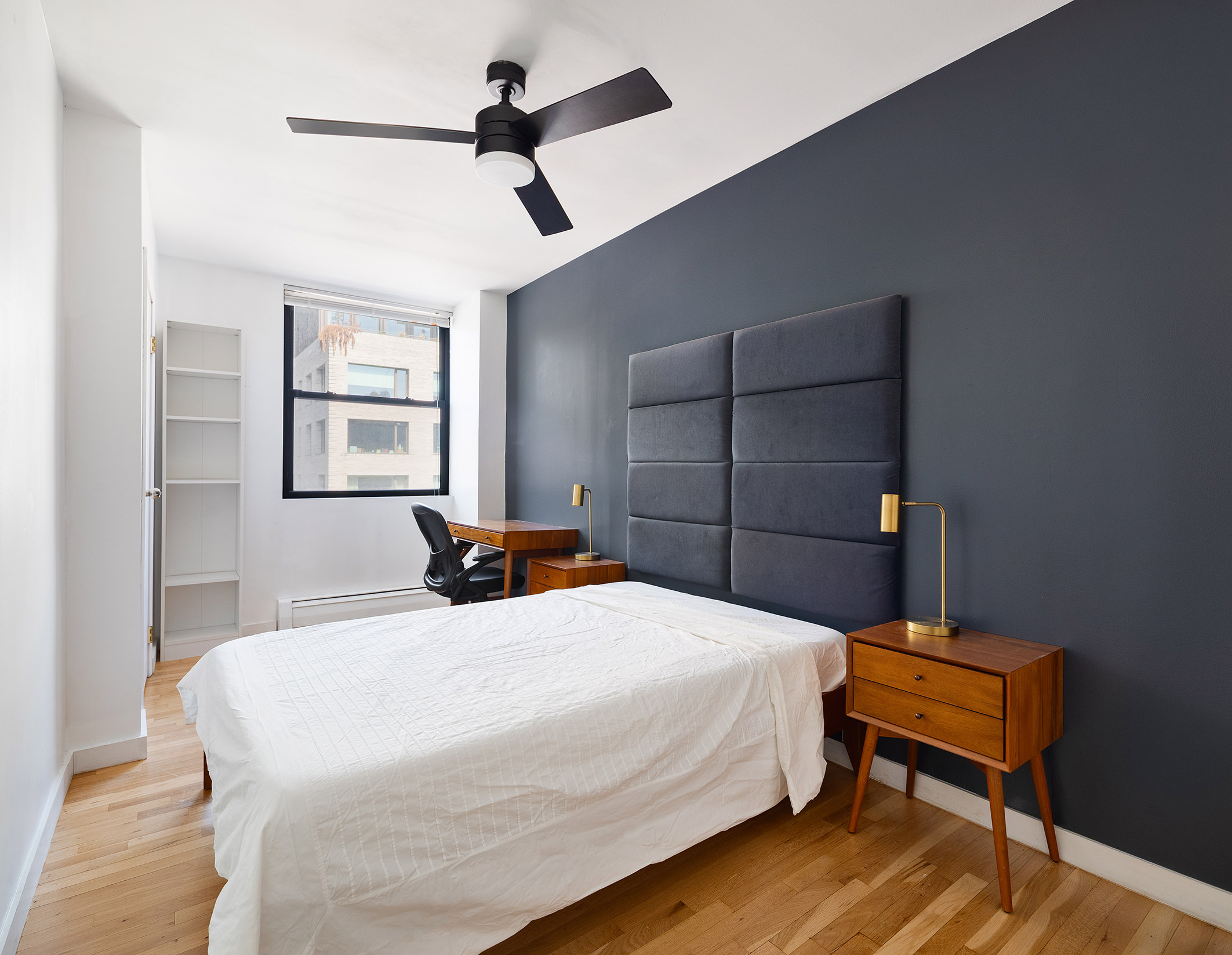 350 West 14th Street, Unit 7E Manhattan, NY 10014 - Photo 4 of 5 a bedroom with a bed and a dresser