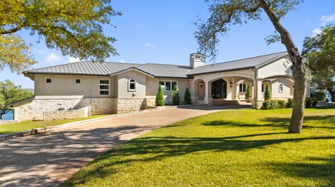 a bedroom with a large window and a bed