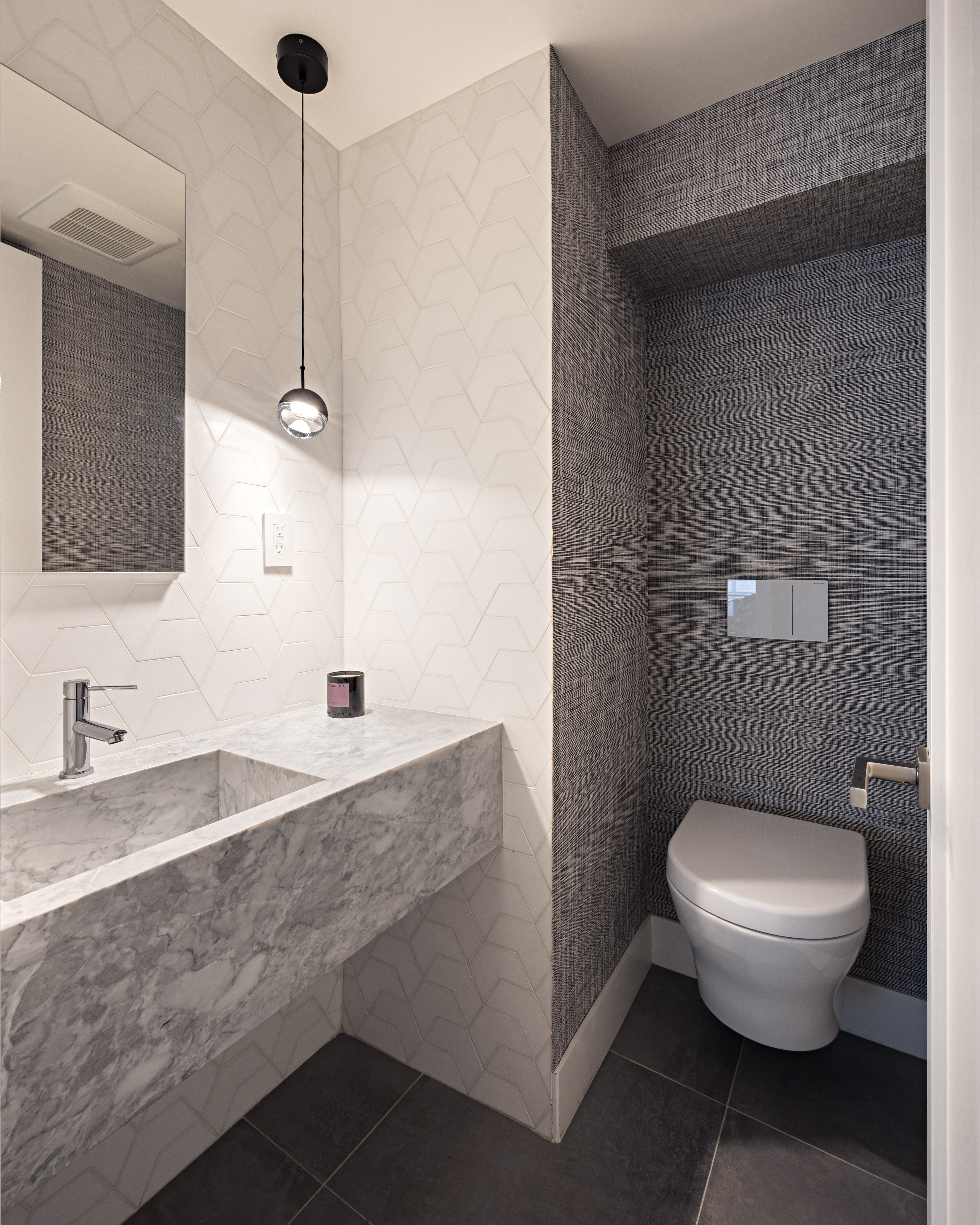 799 Park Avenue, Unit 10A Manhattan, NY 10021 - Photo 11 of 12 a bathroom with a granite countertop sink a toilet and a mirror