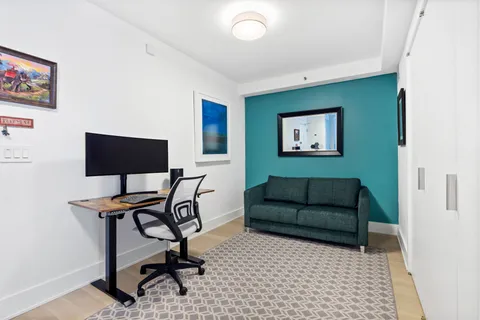 a living room with furniture and a rug