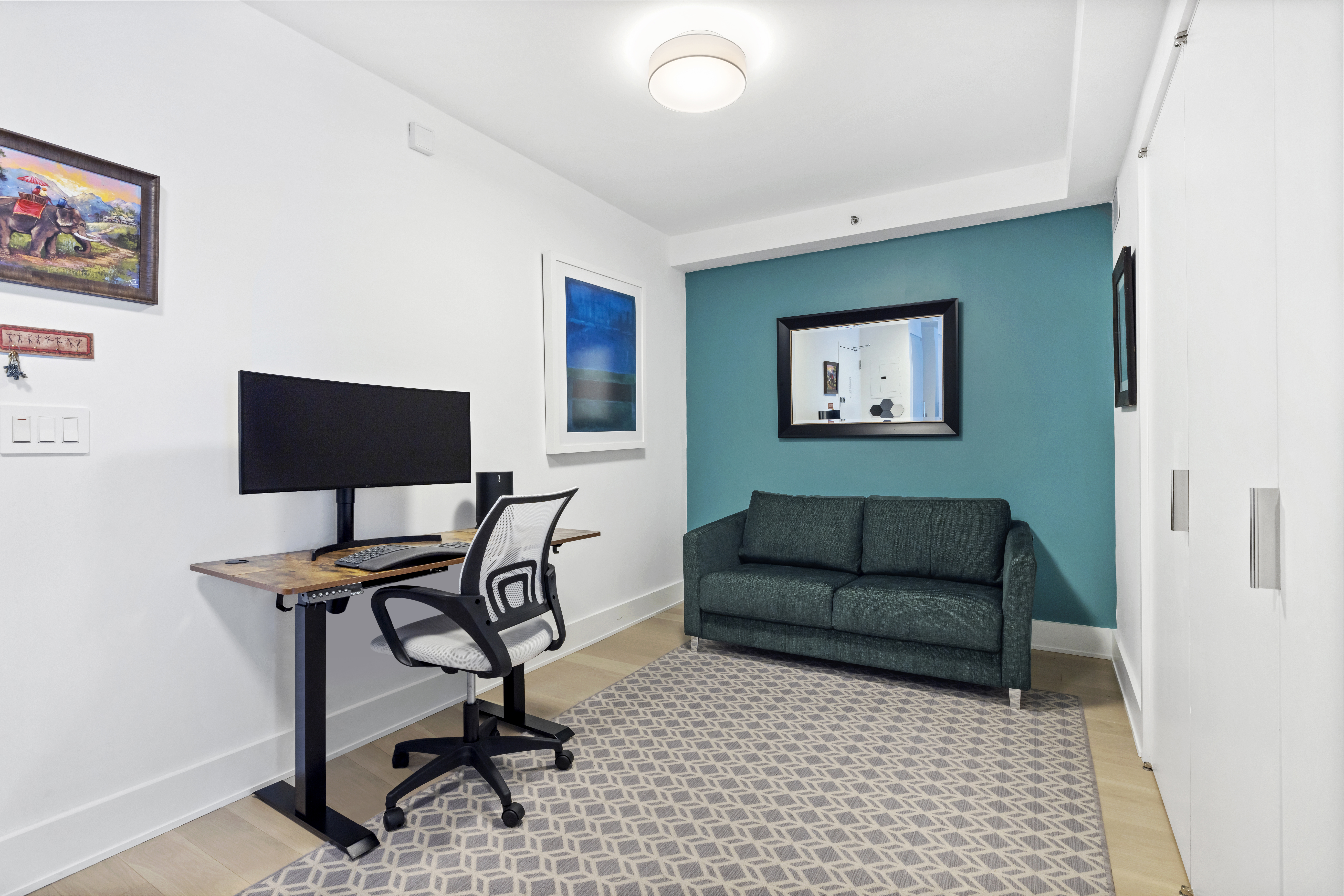 20 River Terrace, Unit 7K Manhattan, NY 10282 - Photo 8 of 9 a living room with furniture and a rug