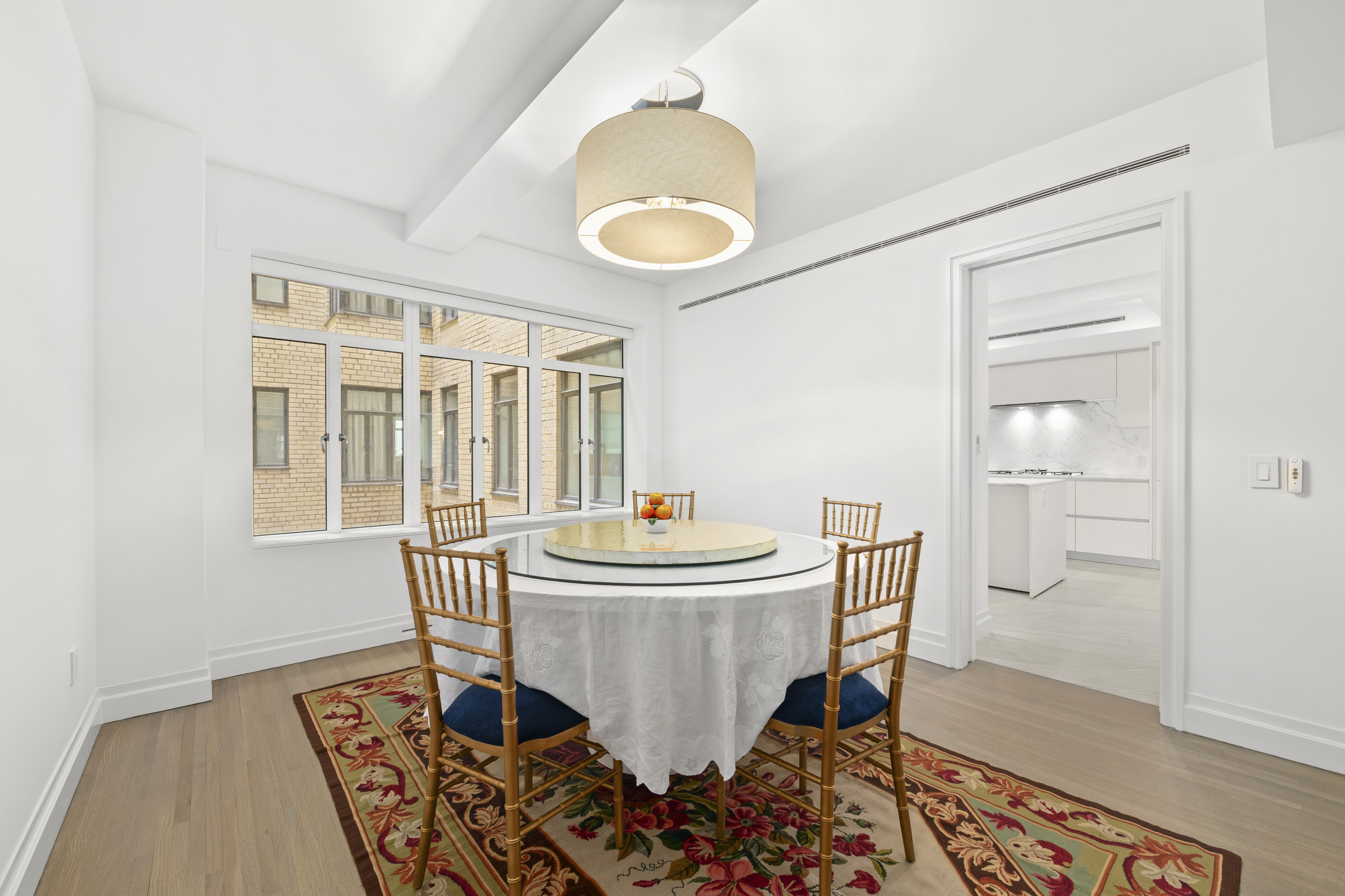 737 Park Avenue, Unit 6A Manhattan, NY 10021 - Photo 5 of 14 a living room with chairs and a table